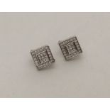 A pair of 18 carat stylish diamond mounted ear cli