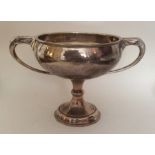 A silver two handled trophy cup. London. Approx. 4