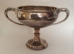 A silver two handled trophy cup. London. Approx. 4