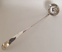 A large silver plated toddy ladle with twisted han