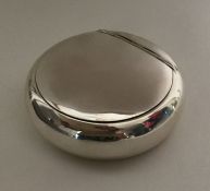 A hinged top squeeze sided silver tobacco box. Bir