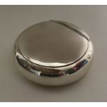 A hinged top squeeze sided silver tobacco box. Bir
