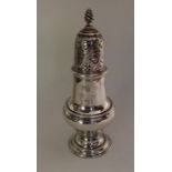 A heavy Georgian silver baluster shaped caster of