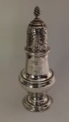 A heavy Georgian silver baluster shaped caster of