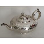 A good quality embossed Victorian silver teapot. L