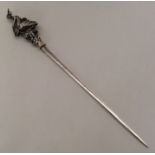 A French silver meat skewer decorated with nesting