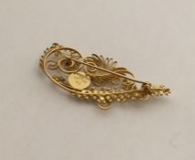 GEORG JENSEN: A rare 18 carat gold brooch in the f