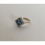 A topaz and diamond Art Deco style cluster ring. A