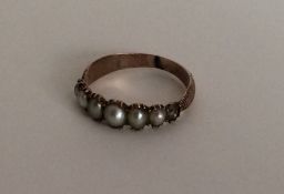An Antique pearl ring with engraved decoration. Ap