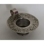 An unusual heavy silver tea strainer. Birmingham 1