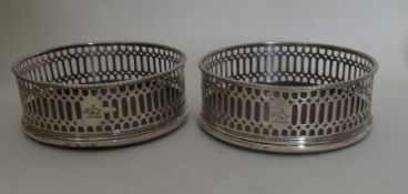 A good pair of George III pierced coasters set wit
