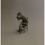 A novelty miniature silver figure of a gentleman i