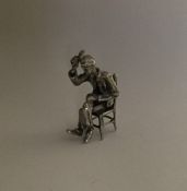 A novelty miniature silver figure of a gentleman i