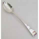 A large OE pattern silver basting spoon. London 18