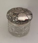 A heavy silver mounted dressing table jar decorate