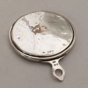 A lady's silver handbag mirror of plain form. Appr