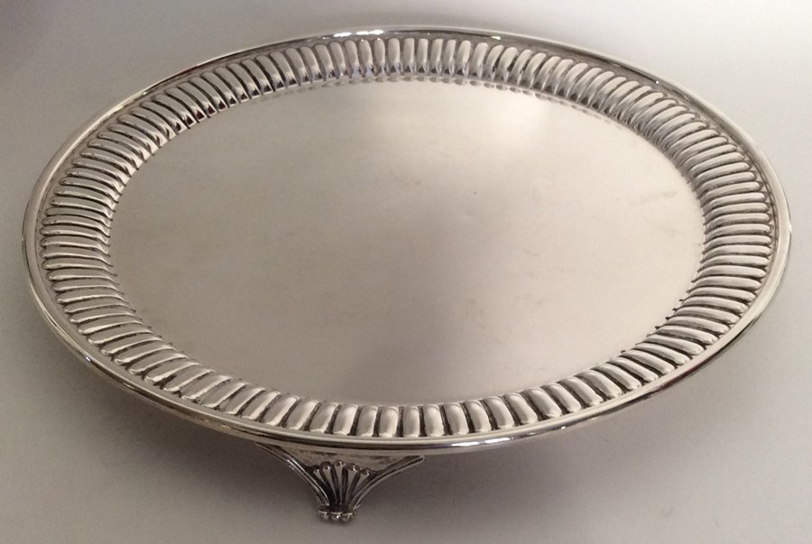 A Victorian silver circular salver with fluted bor