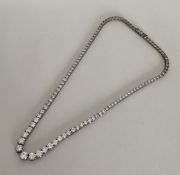 BRIDAL JEWELLERY: A tapering silver and clear ston