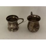 Two Edwardian silver spirits tots, one engraved wi