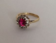 An attractive circular cluster ring in 9 carat mou