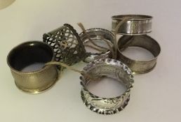 A group of six silver mounted napkin rings. Variou