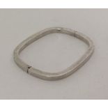 A stylish silver rectangular bangle. Approx. 23 gr