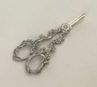 A pair of silver plated grape scissors in the form