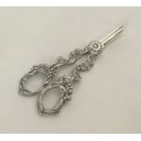 A pair of silver plated grape scissors in the form