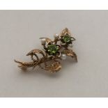 A good pearl mounted brooch in the form of a flowe
