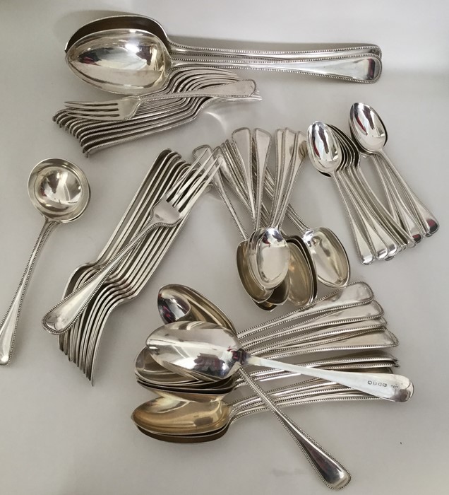 A good quality set of bead edged silver cutlery to
