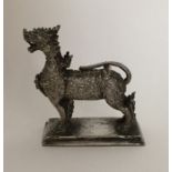 An unusual Chinese model of an animal on pedestal