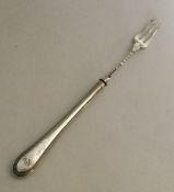 A silver pickle fork with bead handle. Sheffield.