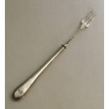 A silver pickle fork with bead handle. Sheffield.