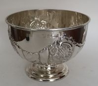 A heavy Edwardian silver rose bowl profusely decor