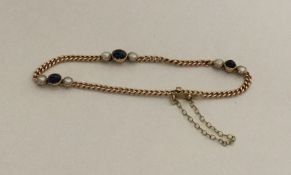 A 15 carat cabochon sapphire and pearl bracelet wi