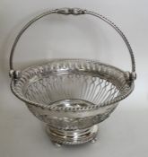 A good George III pierced silver basket with rope
