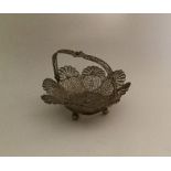 An attractive miniature silver filigree basket wit
