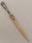 A silver mounted paper knife with twisted handle.