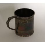 A small Georgian silver mug with reeded decoration