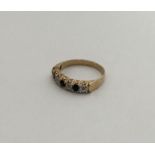 A sapphire and diamond half eternity ring in two c