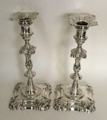 A good pair of cast Georgian silver candlesticks w