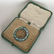 An Antique silver and blue enamelled buckle contai