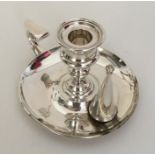 A heavy good quality silver chamber stick together