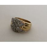 A heavy 18 carat diamond cluster ring in two colou