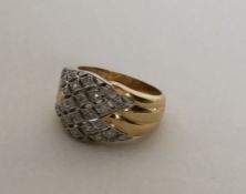 A heavy 18 carat diamond cluster ring in two colou