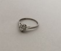 A small platinum single stone diamond ring in claw