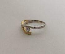 An 18 carat two colour gold single stone ring of a