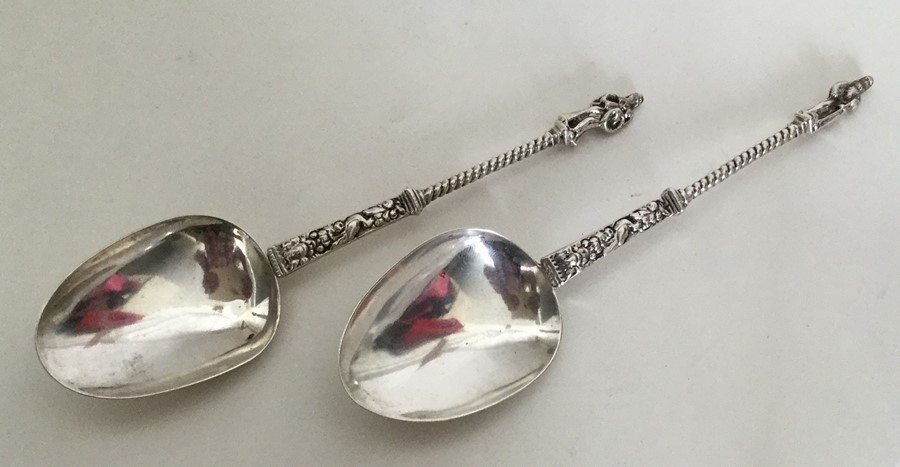 A pair of unusual silver Apostle top tablespoons.