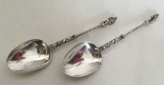 A pair of unusual silver Apostle top tablespoons.