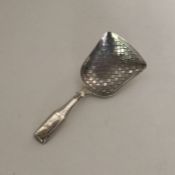 A Victorian silver bright cut caddy spoon with wri